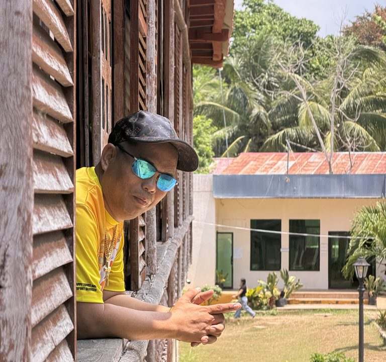 Guest at a heritage window in Siquijor